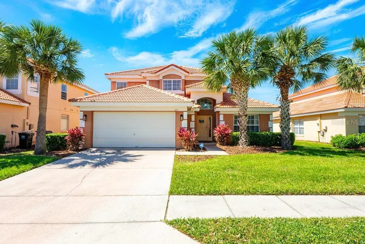 This 5 Bedroom, 4 Full Bath **POOL HOME** comes **FULLY FURNISHED** with a NEW A/C (2023), TILE ROOF, two story living room, screened lanai/pool area and a MAIN FLOOR PRIMARY SUITE!