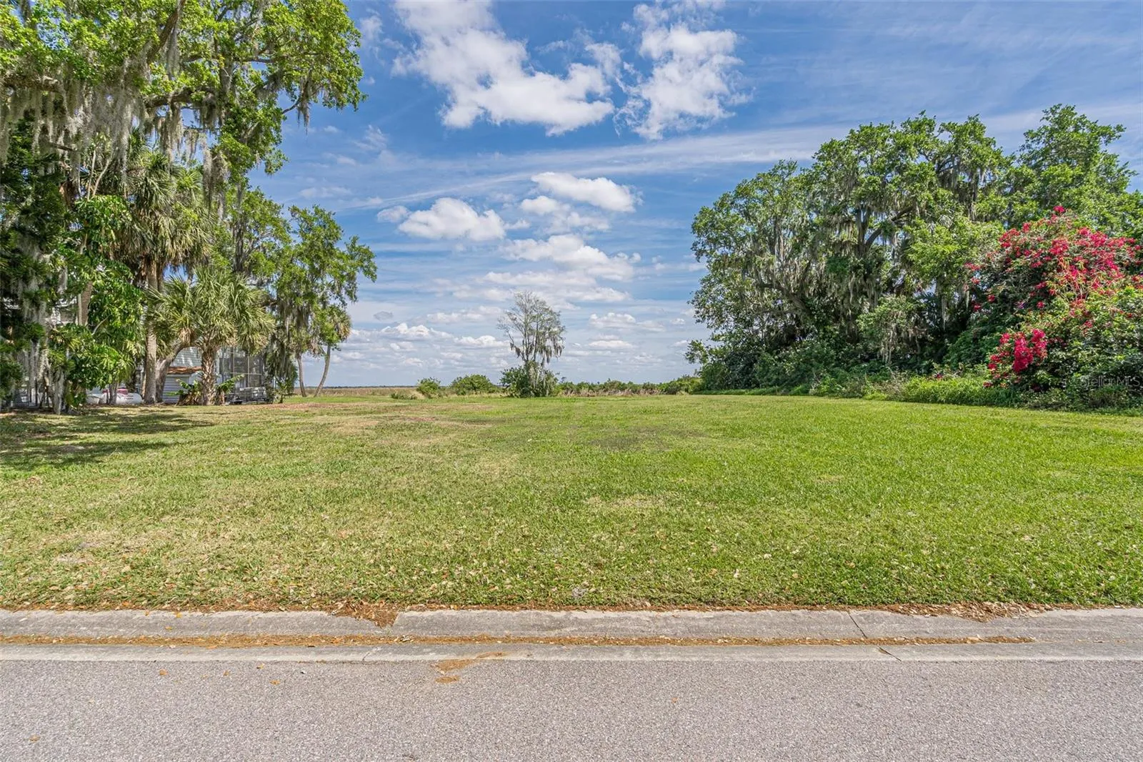 VIEW OF THE VACANT LOT ON HIDDEN HARBOR LANE