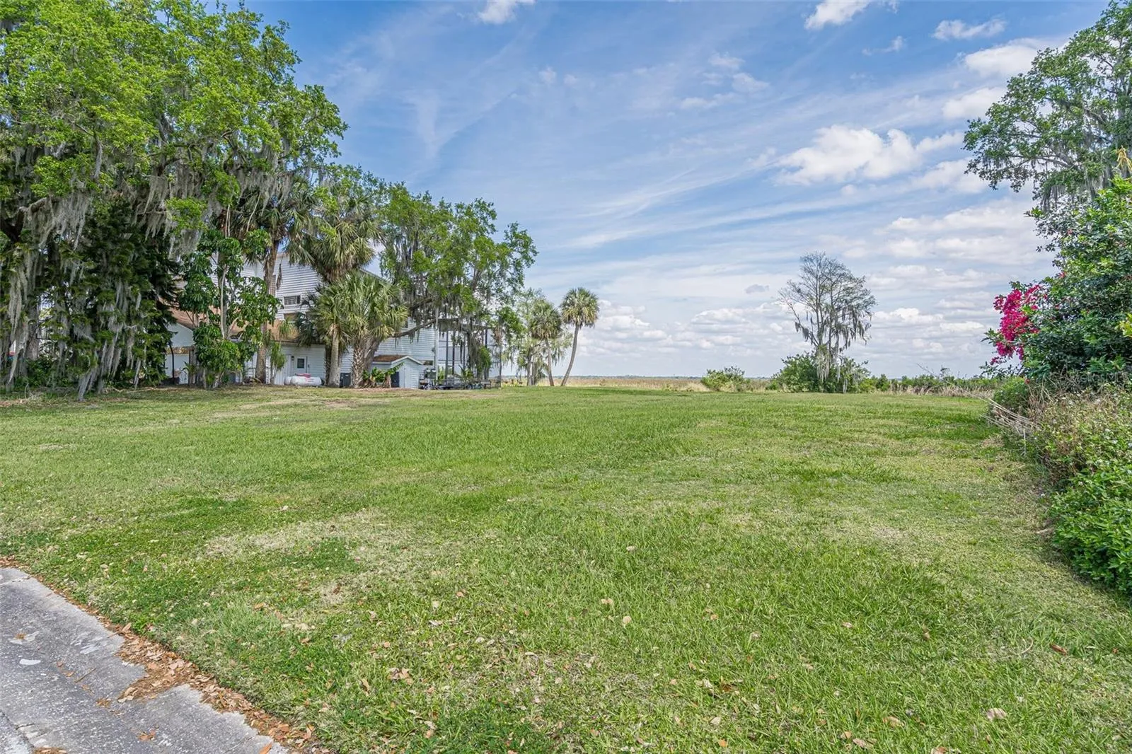 VIEW OF THE VACANT LOT ON HIDDEN HARBOR LANE