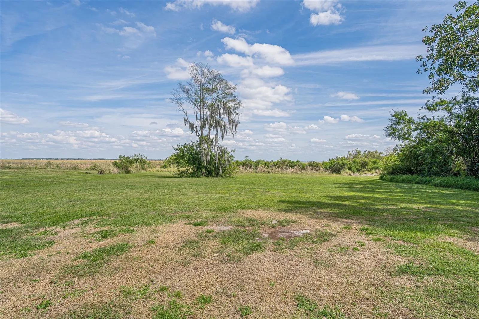 VIEW OF THE VACANT LOT ON HIDDEN HARBOR LANE