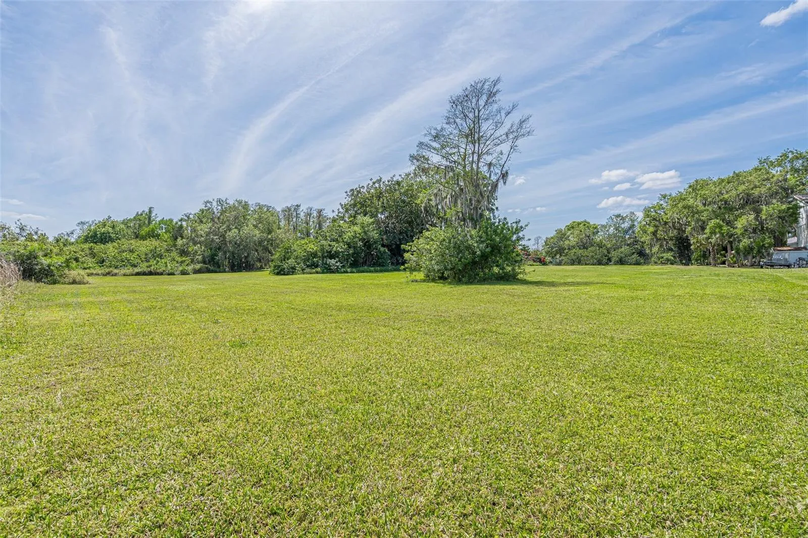 VIEW OF THE VACANT LOT ON HIDDEN HARBOR LANE