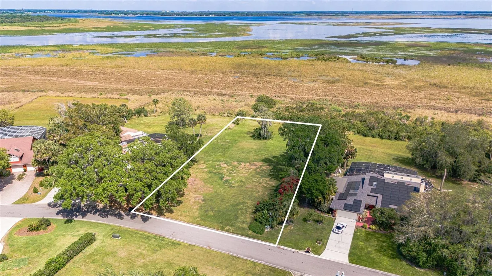 BUILD YOUR DREAM HOME ON THIS BEAUTIFUL LAKEFRONT LOT.