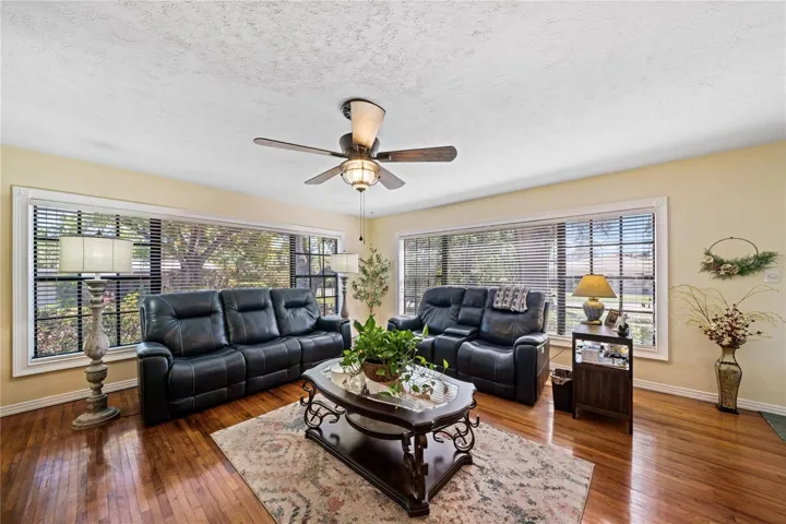 Living Room with beaming hardwood floors