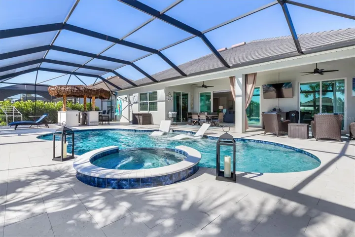 Imagine living in this luxury home with saltwater pool & spa overlooking your boat on the water. Plus tiki hut for outdoor cooking and entertaining!