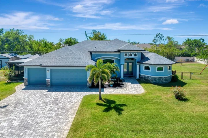 13443 Boabadilla Lane Front with paver drive, welcoming front entrance.