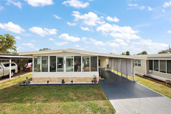 Front of home with extra long driveway-parking area/carport=47'