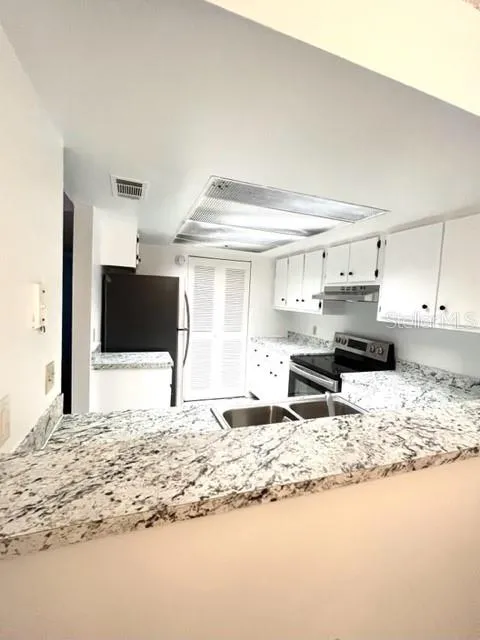 Kitchen: New formica counters and appliances