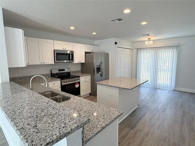 Kitchen with Bar Seating and Island