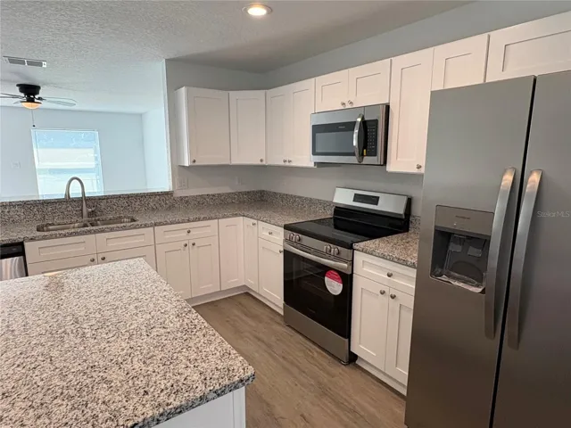 Kitchen with Bar Seating and Island