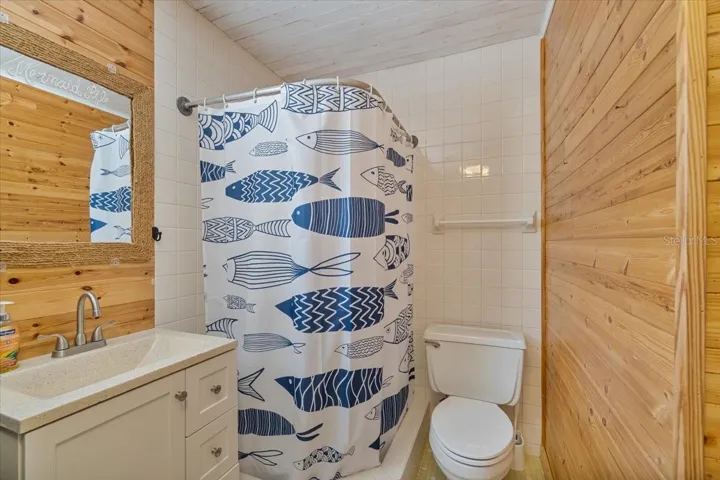Additional bathroom within the lower level enclosure.