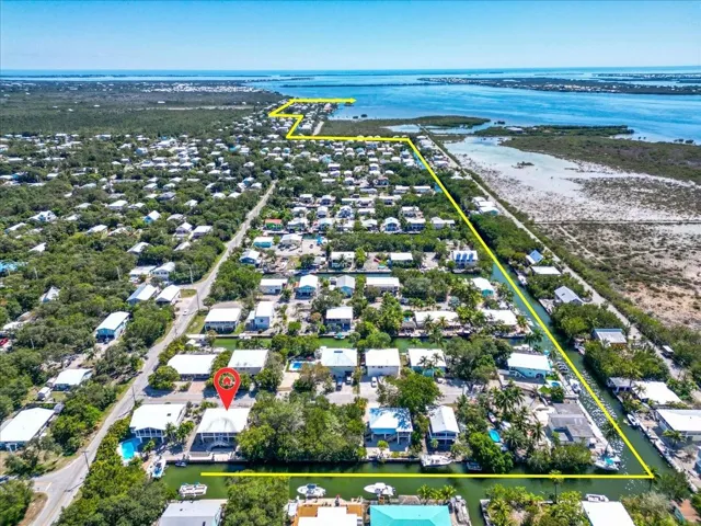 Aerial view highlighting the home’s location within the Eden Pines canal neighborhood.