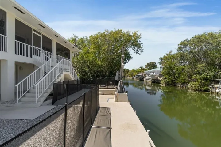 Full concrete seawall along the canal—an increasingly rare feature in the Florida Keys where new full seawalls are generally no longer permitted.