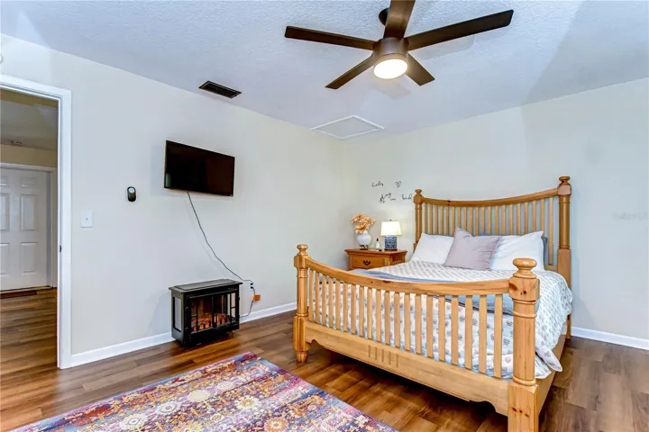 The bedroom features a comfortable queen size bed