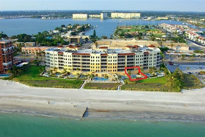 .. Aerial Of Sereno. Residence #203 Outlined ..NOTE: Shot taken Before Storm-  All Exterior Vegetation is Being Replaced As We Speak. Seller Has Paid Assessment for This Project. Completion Date  June 2025. Complex is Spending Close to a Million Dollars to Completely Redo Exterior Vegetation, Common Pool Area and Fencing.