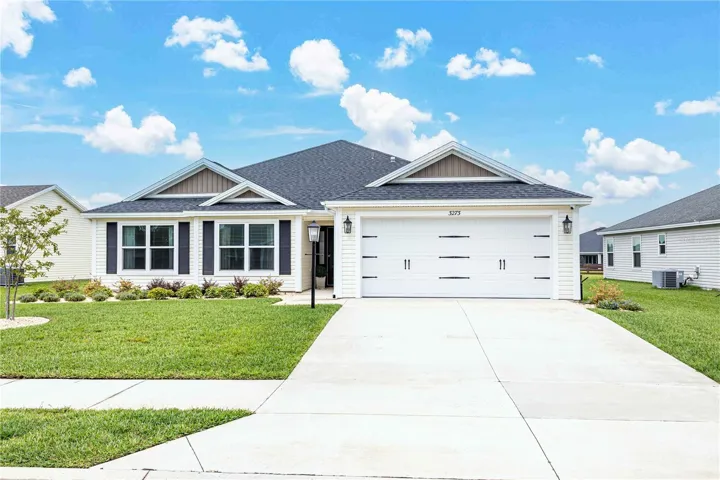 Impressive exterior with fresh landscaping, two-car garage overflows with curb appeal