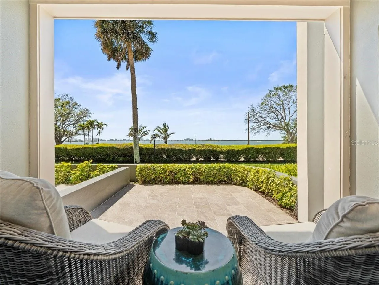 Private covered lanai and open waterfront patio