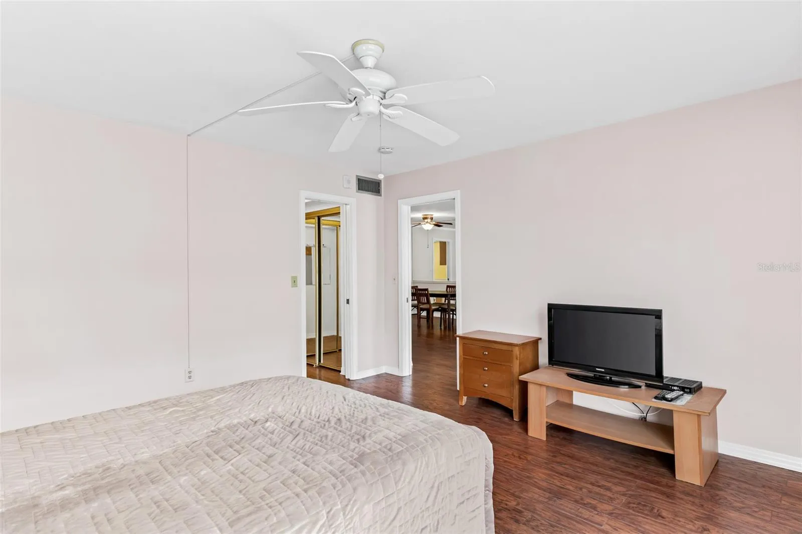 Primary bedroom with balcony access
