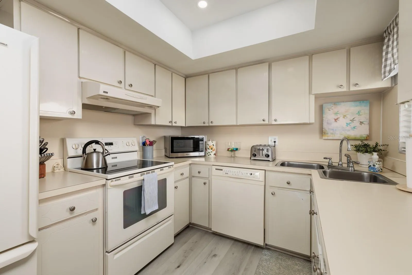 Kitchen w/corner double sink &amp; large closet pantry. Window over sink.