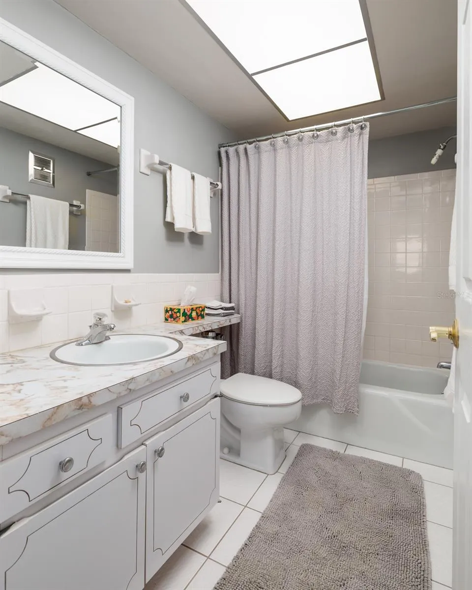 Primary bathroom w/linen closet. Exhaust fan to the outside of bldg.