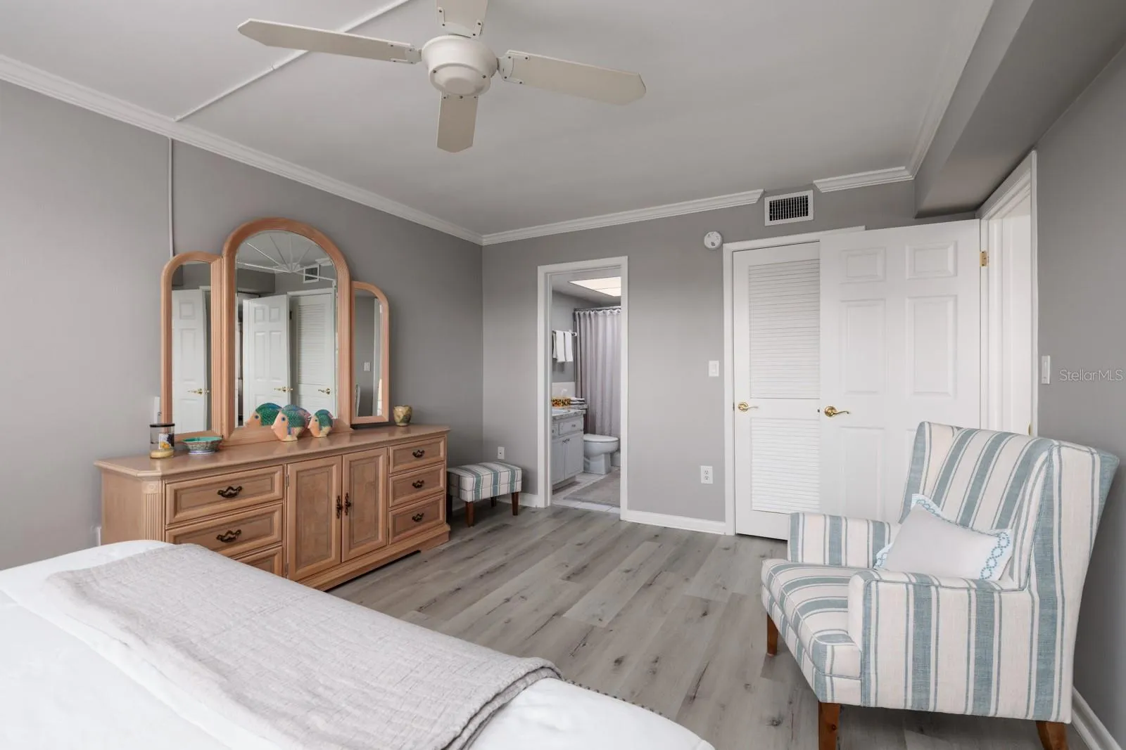 Primary bedroom w/En-suite bath &amp; walk-closet on right.