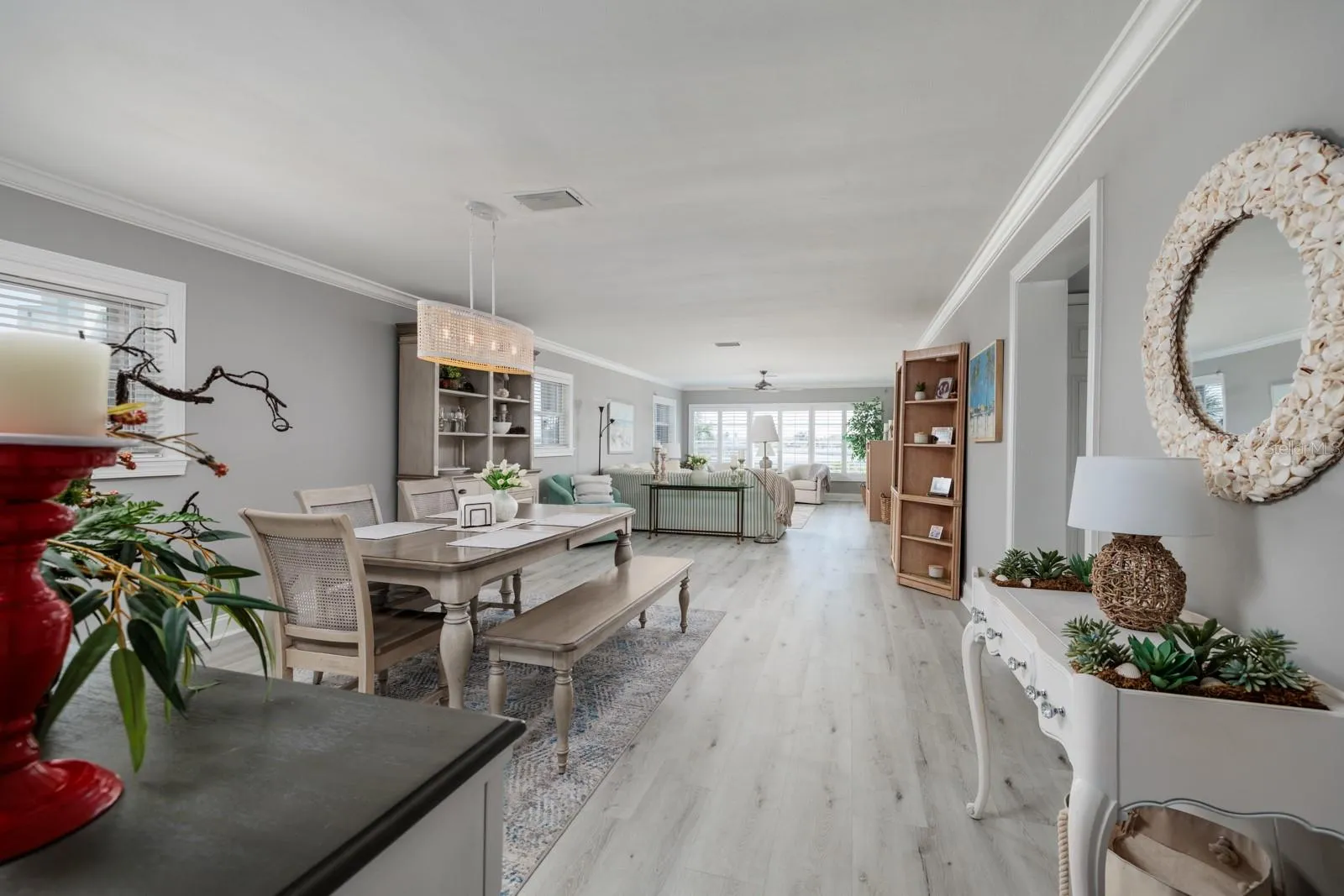 Great Room (15'x41'). Luxury vinyl plank flooring. Crown molding. Sold turnkey.
