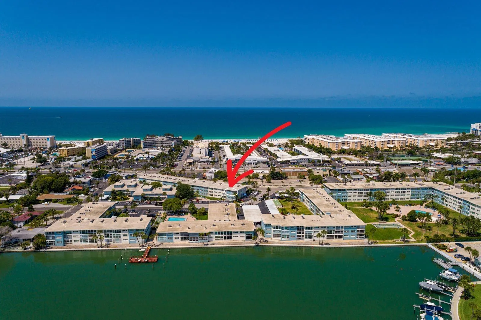 Penthouse corner unit. Boca Ciega Bay partial views, walk to beach &amp; fishing pier/boat slips.