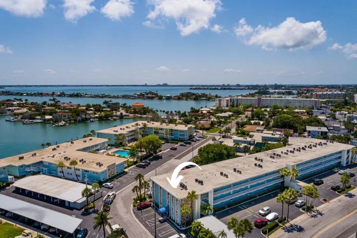 2/2 top floor, 1425 sq ft w/Hurricane Shutters & carport.