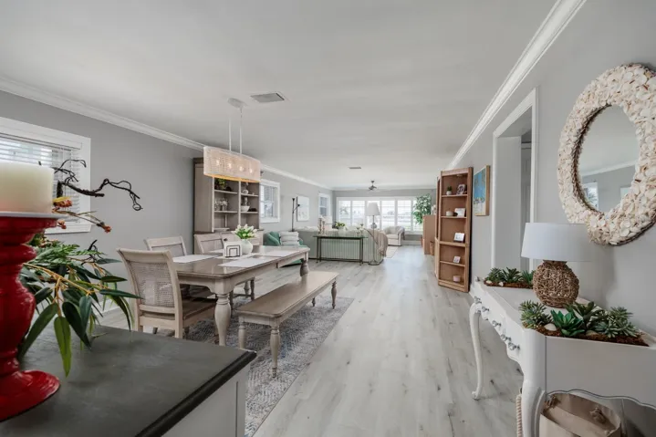 Great Room (15'x41'). Luxury vinyl plank flooring. Crown molding. Sold turnkey.