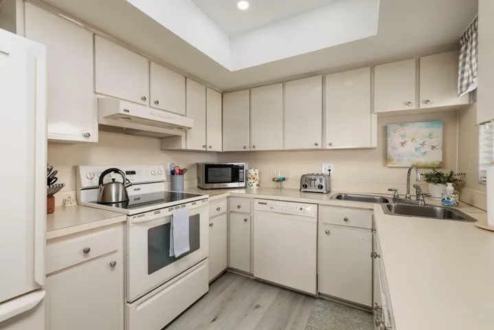 Kitchen w/corner double sink &amp; large closet pantry. Window over sink.