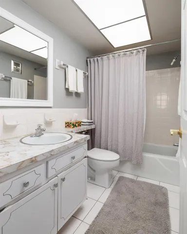 Primary bathroom w/linen closet. Exhaust fan to the outside of bldg.