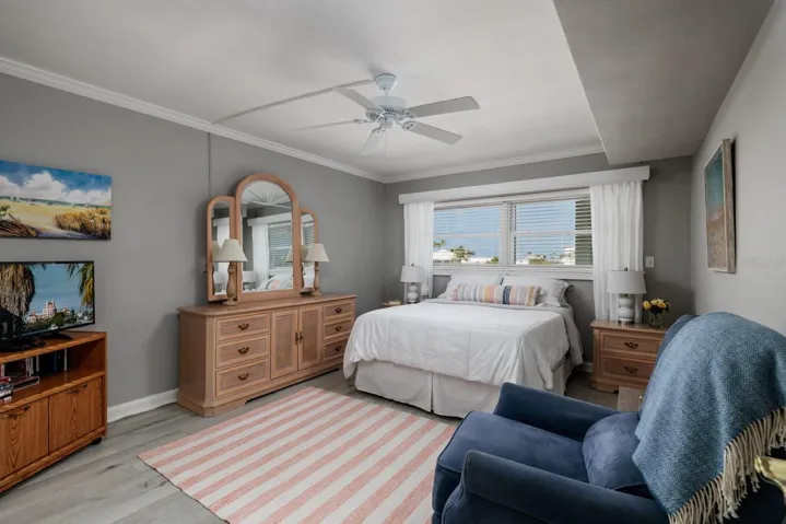 2nd bedroom (12'x15'). Crown molding. Window w/Hurricane shutter. Split bedrooms on opposite ends of condo.