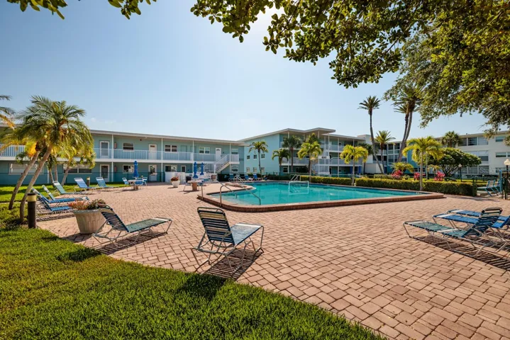 South pool (not heated) by the pier. Grilling area next to pool.