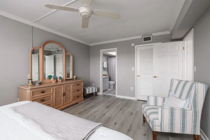 Primary bedroom w/En-suite bath & walk-closet on right.