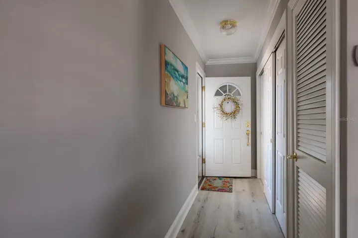 Foyer w/large storage closet & A/C-water heater closet. Metal front door.