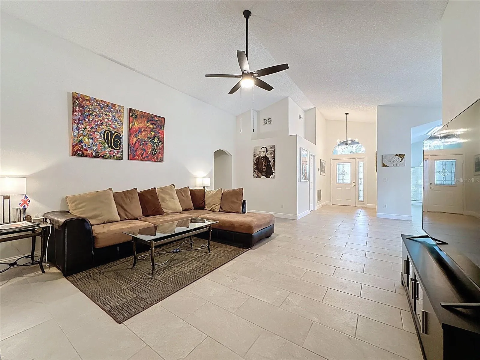 Entryway as enter into Great room -new tile thruout the home.