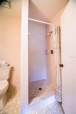 Primary bath, shower, no tub. Ceramic tile flooring