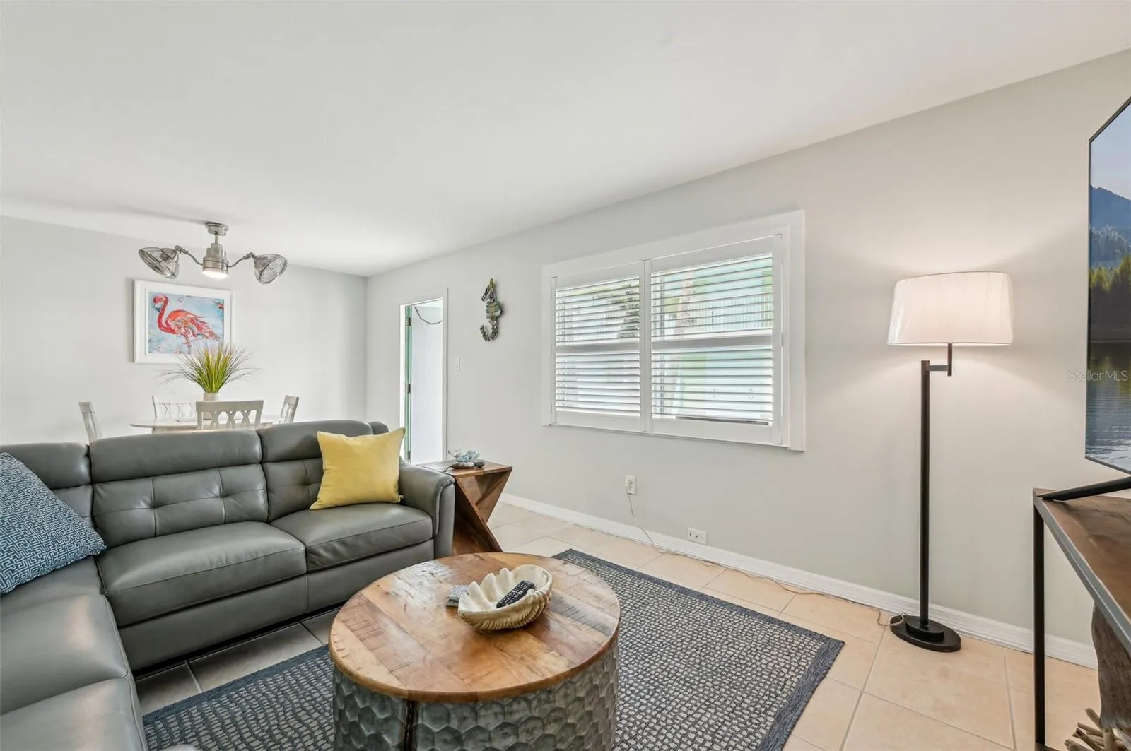 Living room with access to dining and kitchen areas