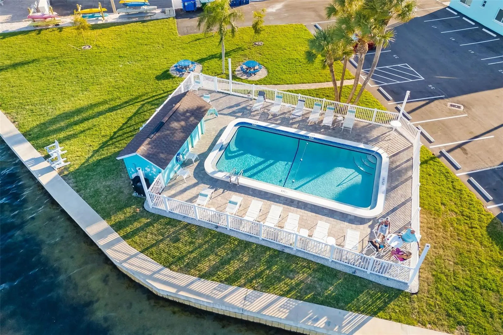 Community waterfront pool area overlooking Sarasota Bay.