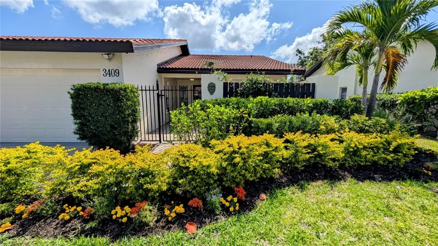 Exterior with gated entrance to private patio