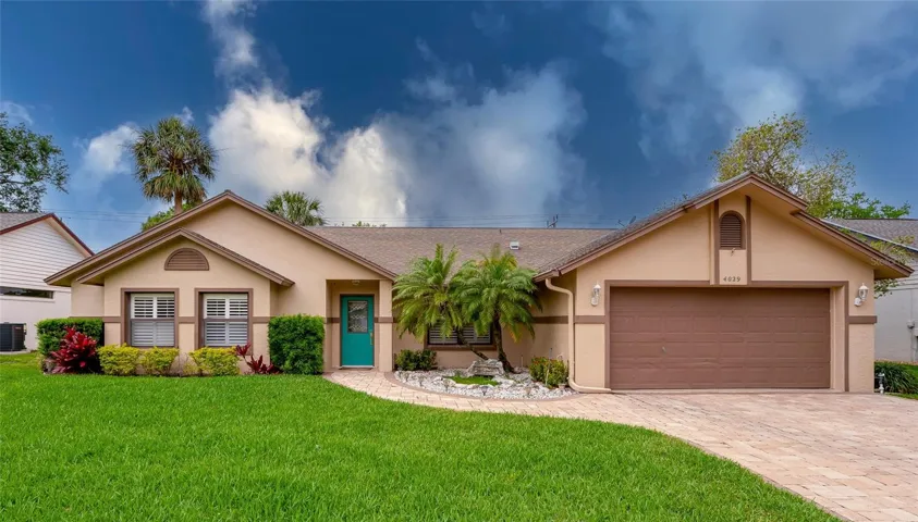 Lush lawn and paver drive