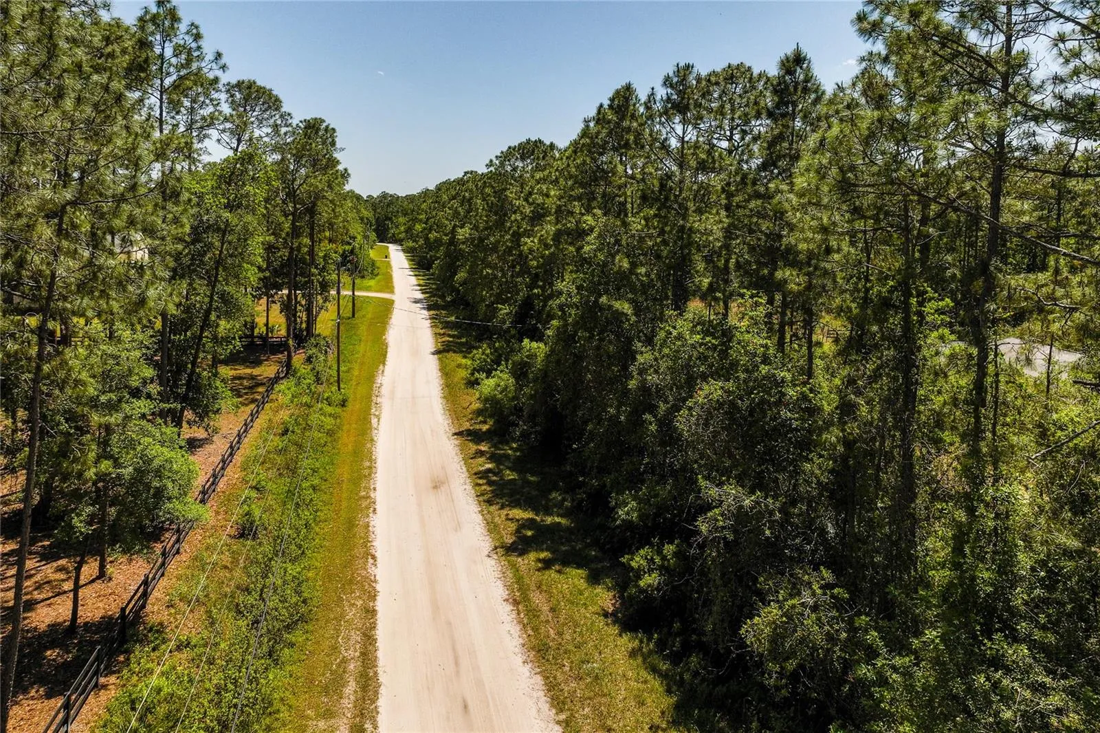 The road leading to the 5 acre parcel.  The seller states the home is in the wet lands and partially in the flood plain.  It has never flooded in their owners ship.
