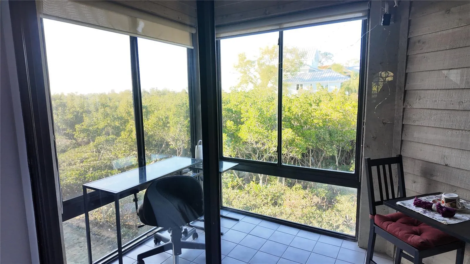 Lanai can be opened to central AC/Heat and has views of the mangroves, Gulf of Mexico and Sunset Beach.... Howard Beach in the background.