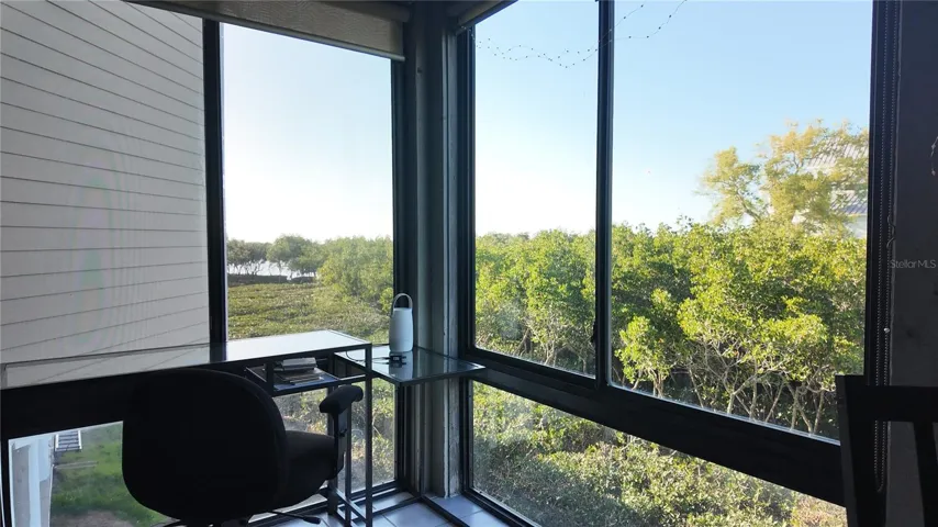 Lanai can be opened to central AC/Heat and has views of the mangroves, Gulf of Mexico and Sunset Beach.... Howard Beach in the background.