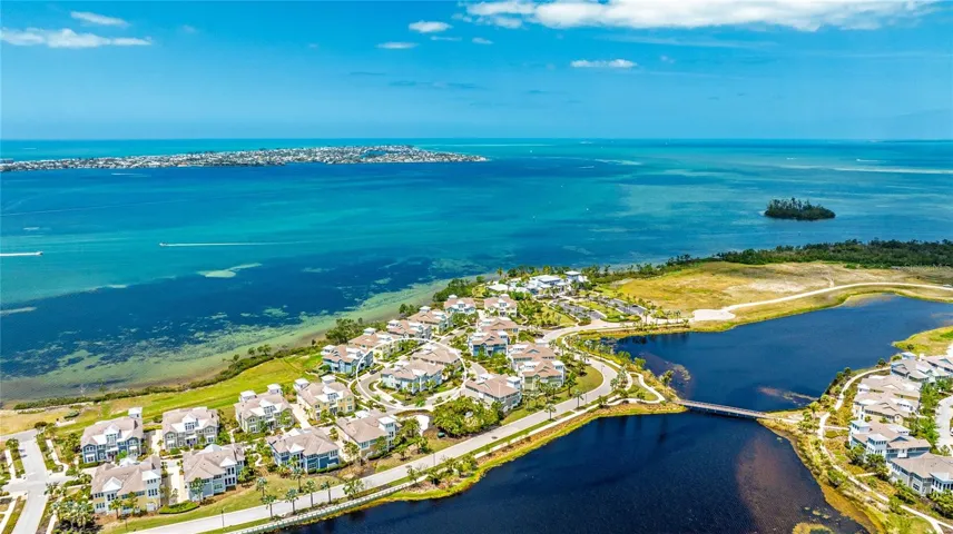 Aerial View of Home and Surrounding Water