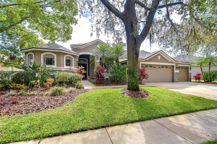 Step into tranquility with this beautifully designed and landscaped home