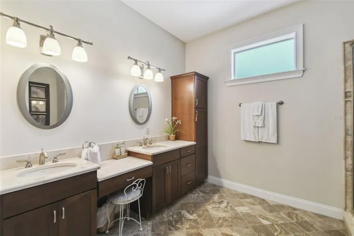 The huge 2nd level full bathroom with double sinks, vanity area. The two upstairs bedrooms share this spacious bathroom.