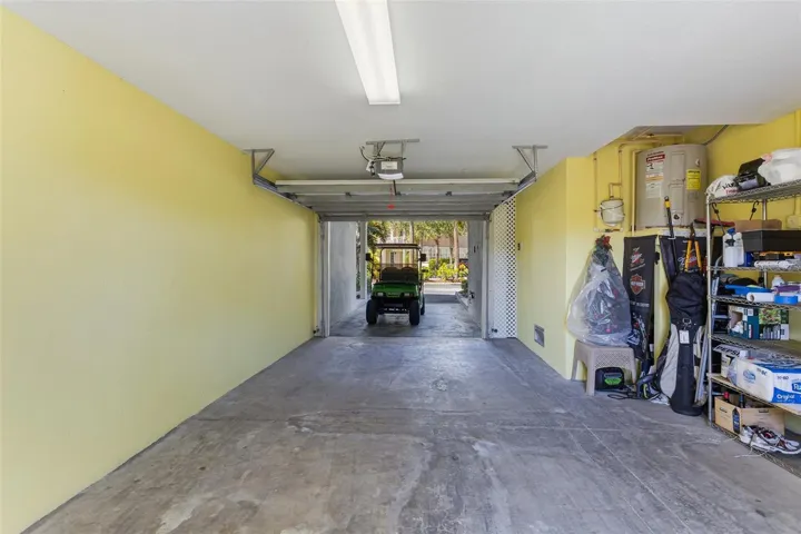 Garage area with storage on teh side. There is also storage off the back patio.