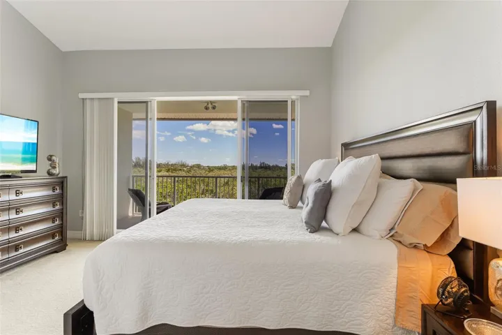 Primary bedroom overlooks the canal. From this balcony you can see the Skyway Bridge