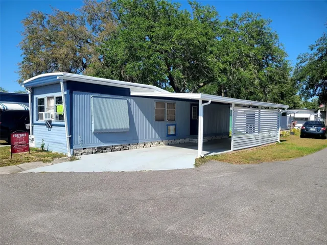 Front of Home with 2 Car Parport Tandem Parking
