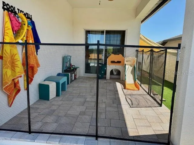 Back Patio with child safey screen and ceiling fan